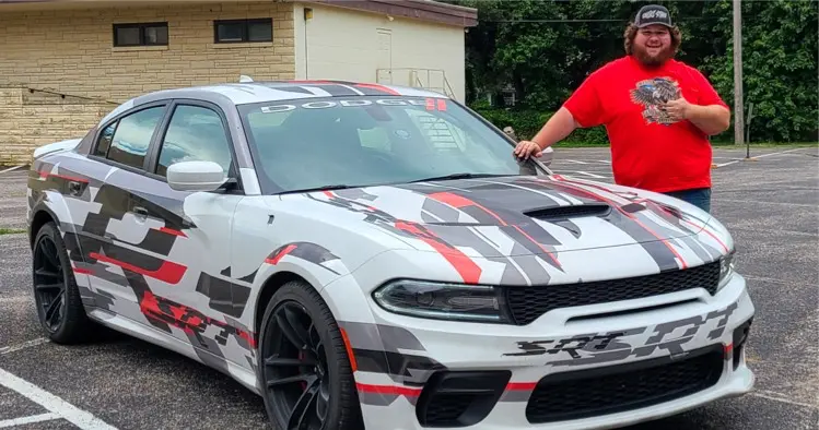 A picture of Westen Champlin with one of their rides